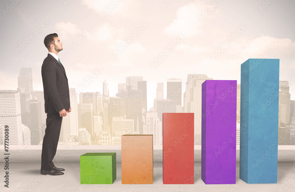 Business person climbing up on colourful chart pillars concept Business person climbing up on colourful chart pillars concept