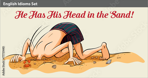 A boy putting his head in the sand