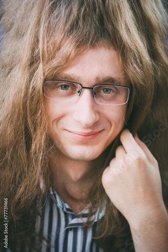 Portrait Of Hippie Hippy Young Man Guy With Glasses And Long Hai