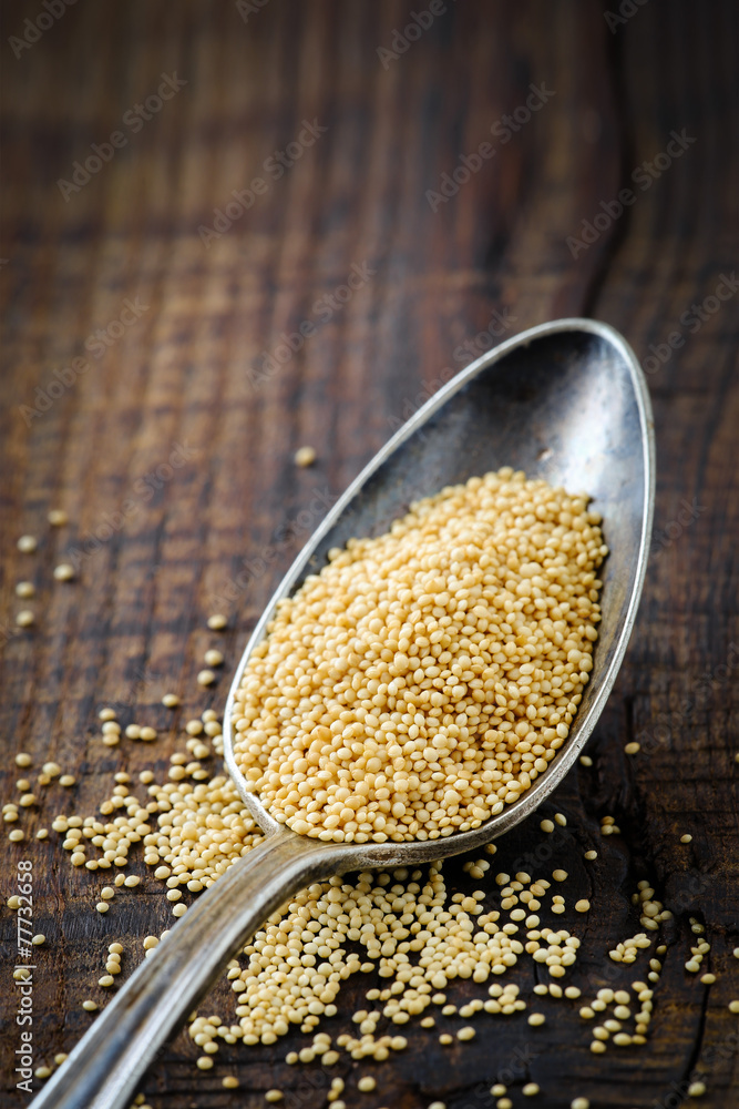 Organic amaranth grain on wood with copy space Organic amaranth grain on wood with copy space