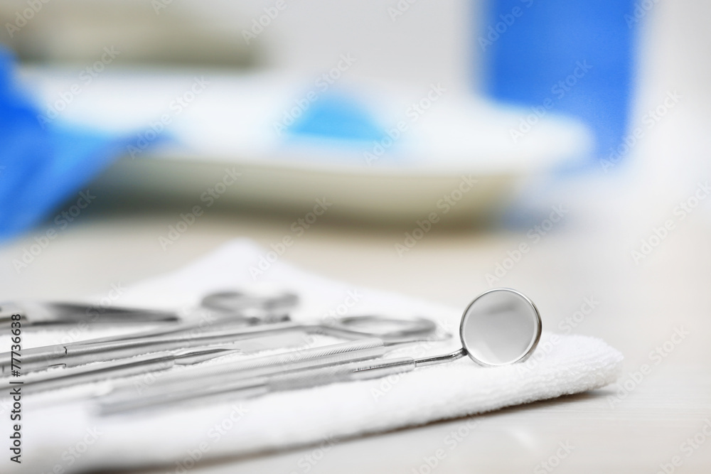 Set dentist tools on napkin on table close up Set dentist tools on napkin on table close up