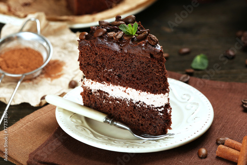 Delicious chocolate cake on table close-up