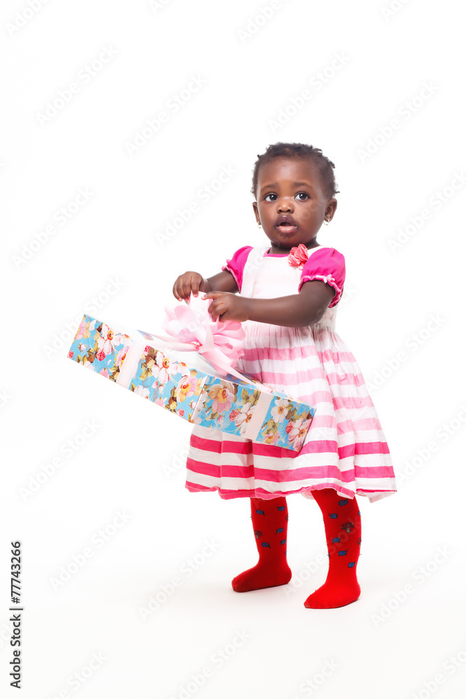 Beautiful black baby girl isolated in white with a gift Beautiful black baby girl isolated in white with a gift