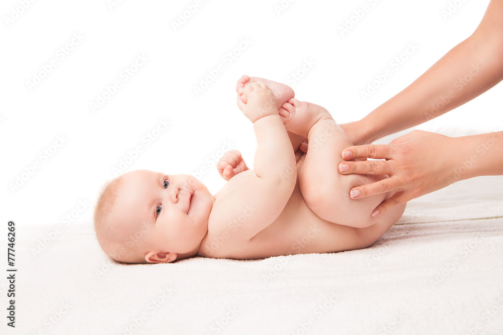 Cute baby lying. touching his feet, hands helping Cute baby lying. touching his feet, hands helping