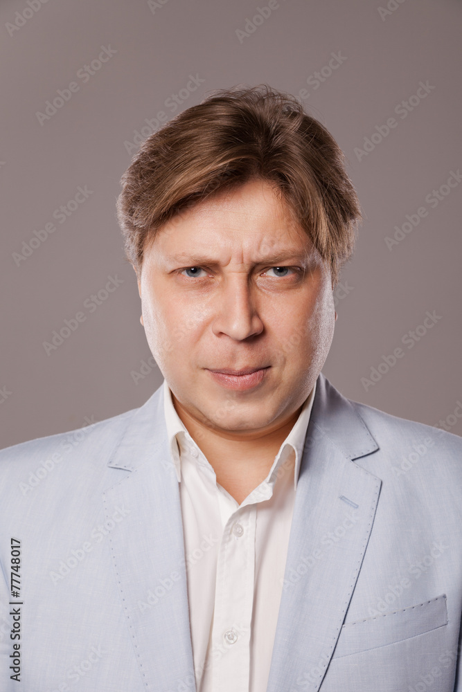 Angry Frowning Middle Age Man in Blue Jacket Angry Frowning Middle Age Man in Blue Jacket