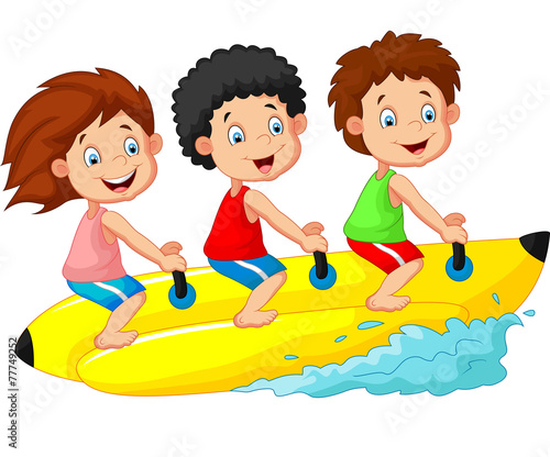 Happy kids riding a banana boat