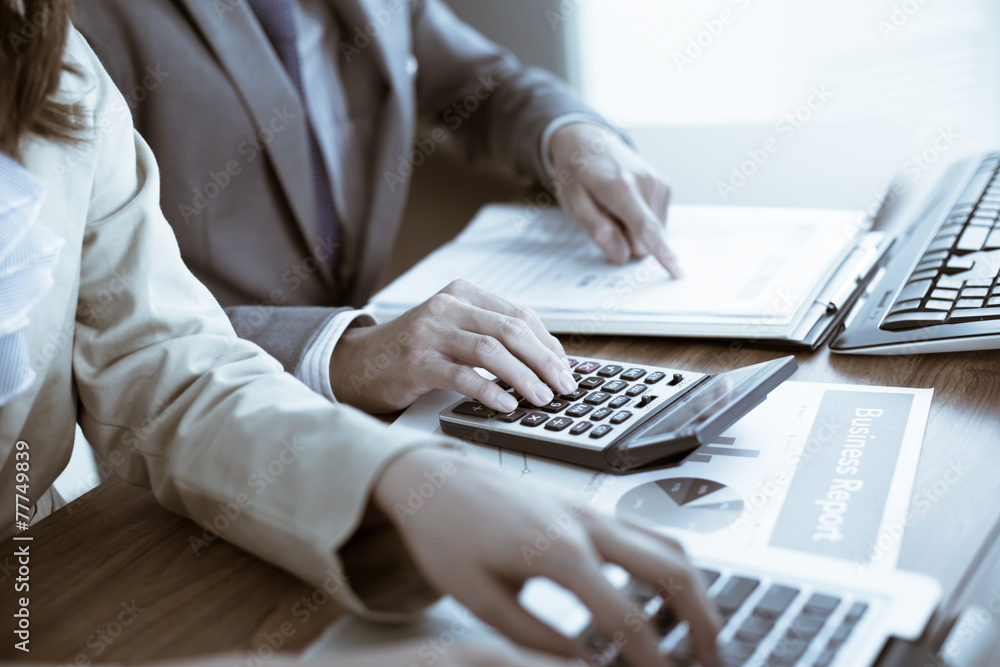 Business people discussing the charts and graphs showing the res Business people discussing the charts and graphs showing the res