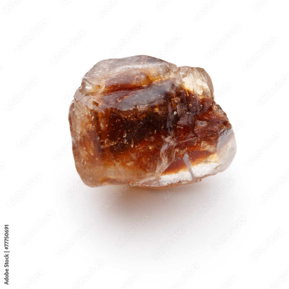 Brown caramelized lump cane sugar cube isolated on white backgro Brown caramelized lump cane sugar cube isolated on white backgro