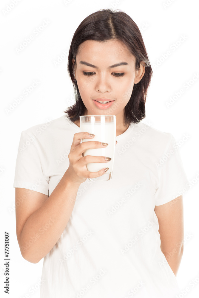 Laughing young woman with a glass of milk Laughing young woman with a glass of milk