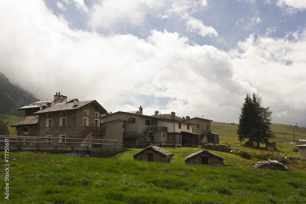 Traditional stone house in the valley floor of Madesimo, Italy Traditional stone house in the valley floor of Madesimo, Italy