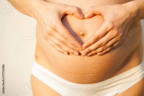 Wallpaper Mural Pregnant woman with concept of love Torontodigital.ca