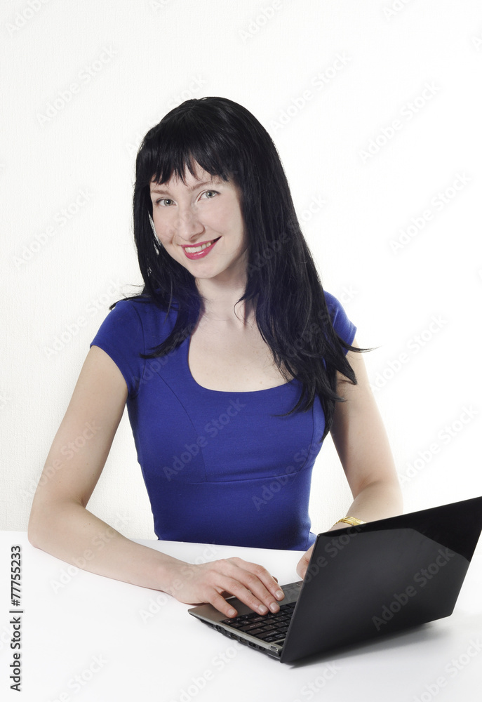 Beautiful girl with black hair works for laptop Beautiful girl with black hair works for laptop