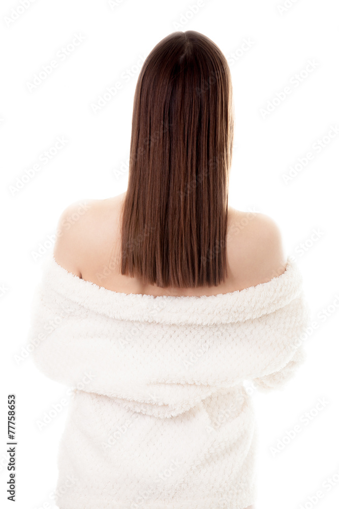 Naklejka premium Sexy young female taking off white bathrobe, back view