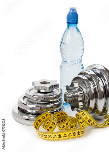 Concept of healthy lifestyle. Water, dumbbells, measuring tape