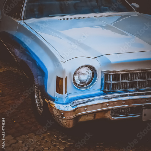 Old retro or vintage car front side. Vintage effect processing