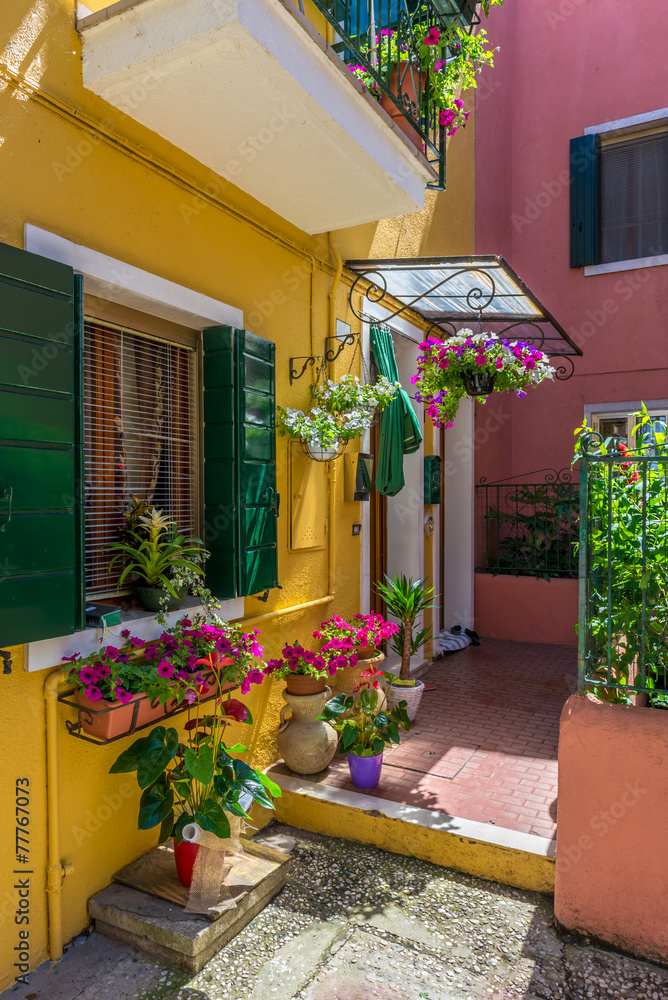 Obraz premium Street with colorful buildings in Burano island, Venice, Italy