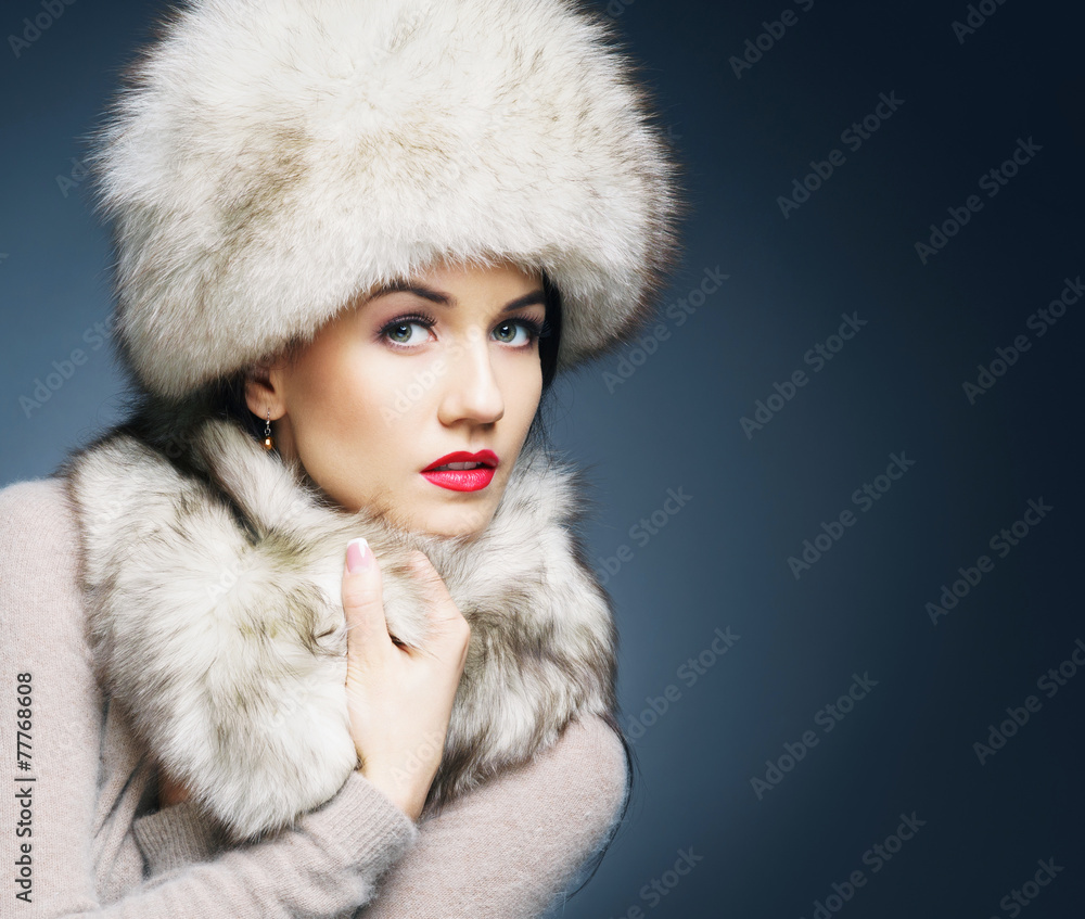 Fashion style portrait of a woman in an elegant winter clothes Fashion style portrait of a woman in an elegant winter clothes