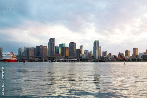 Miami city skyline with bridge and cruise ship at sunset
