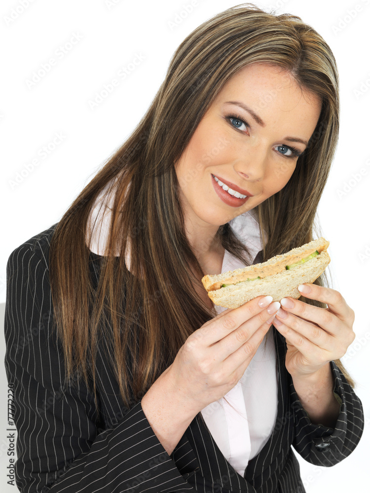 Young Business Woman Eating a Brown Bread Sandwich Young Business Woman Eating a Brown Bread Sandwich