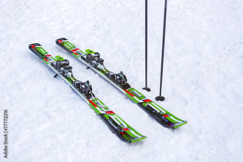 Pair of skis and and ski sticks on snow