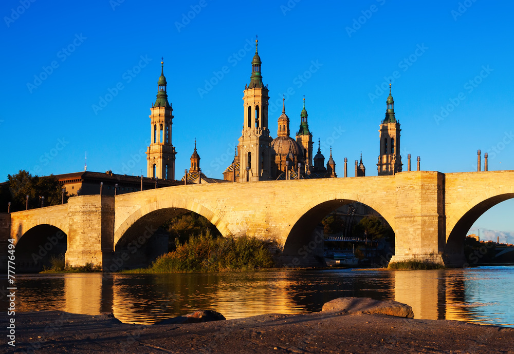 Vintage bridge and  Cathedral in   Zaragoza,  Spain