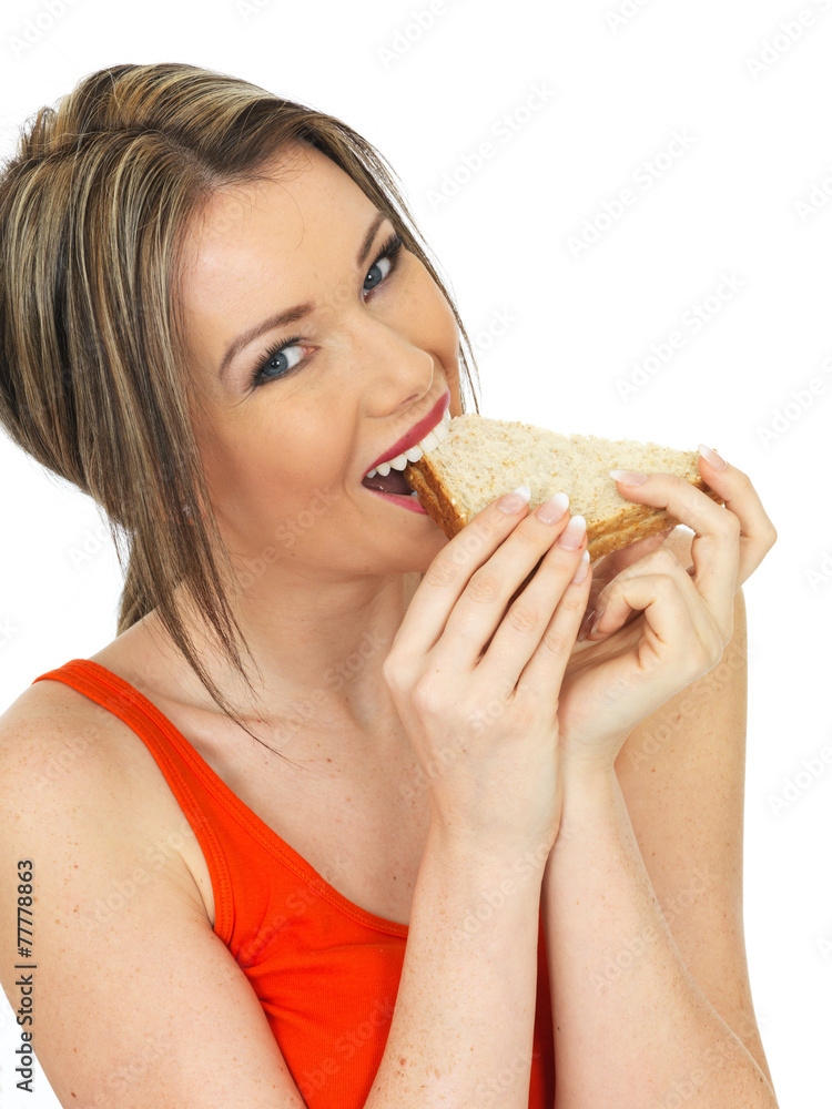 Young Woman Eating a Salmon and Cucumber Brown Bread Sandwich Young Woman Eating a Salmon and Cucumber Brown Bread Sandwich