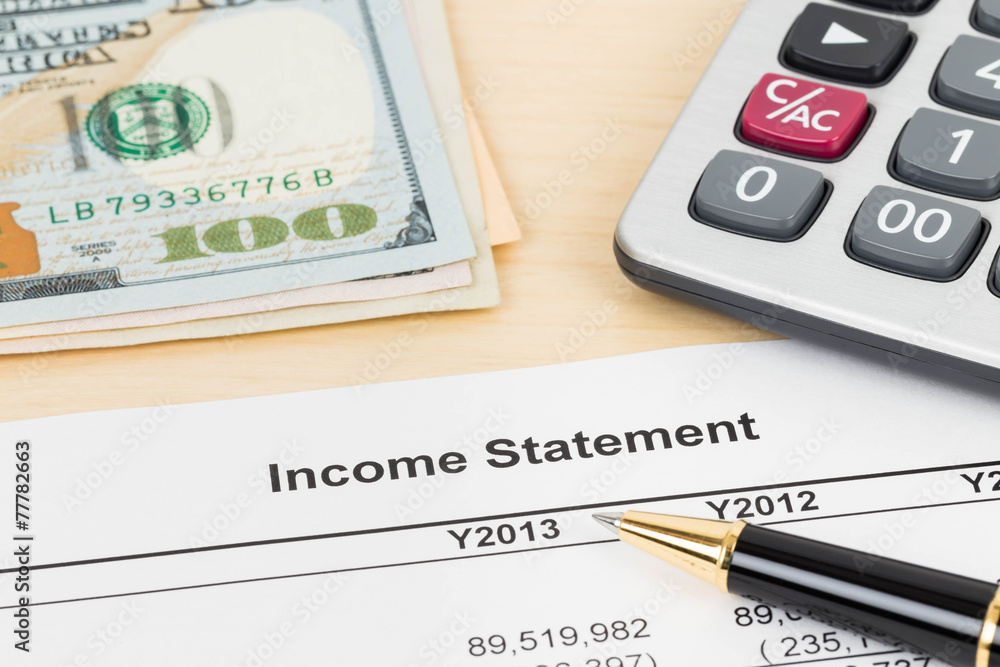 Income statement financial report with pen, banknote, and calcul Income statement financial report with pen, banknote, and calcul