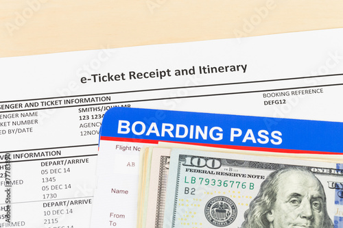 E-ticket with banknote, and boarding pass