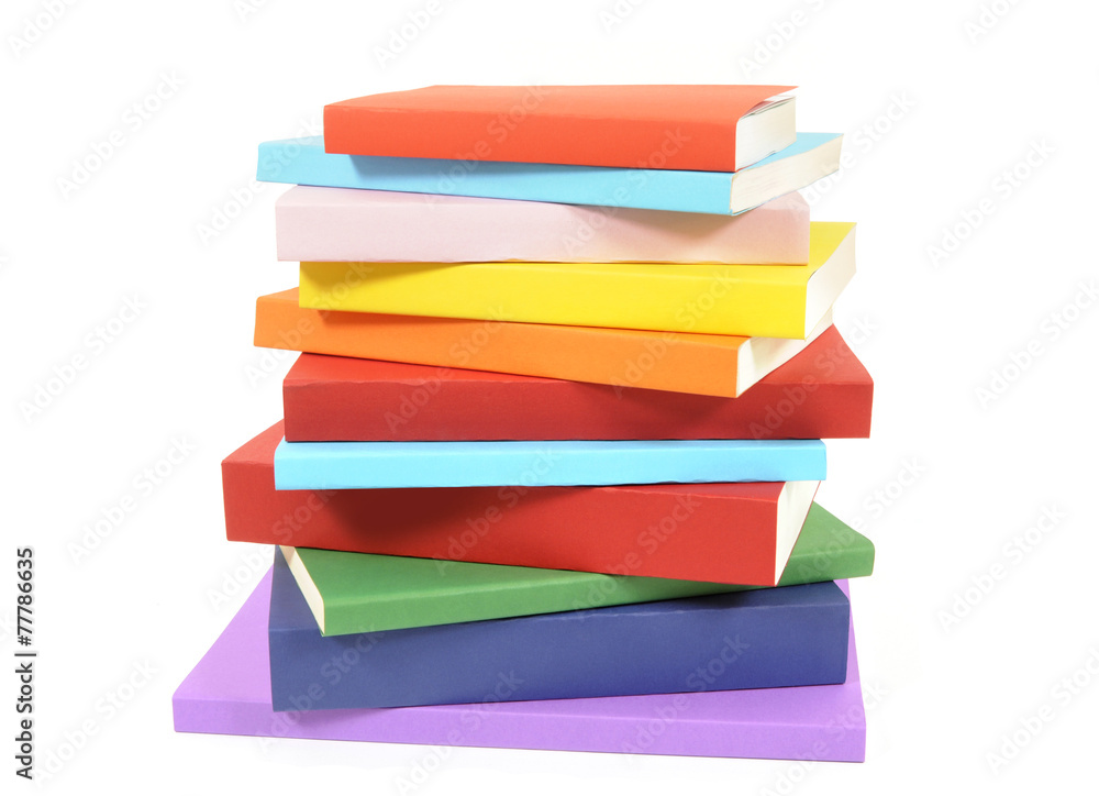 Fototapeta premium Untidy stack of colorful paperback books isolated white background photo