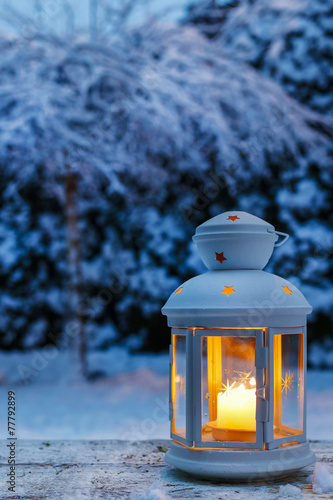 Lantern in garden, winter evening © agneskantaruk