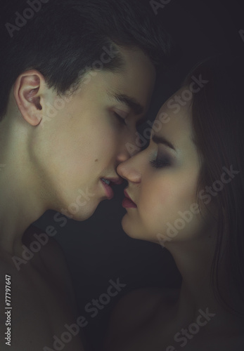 Kissing couple portrait. Instagram toned.