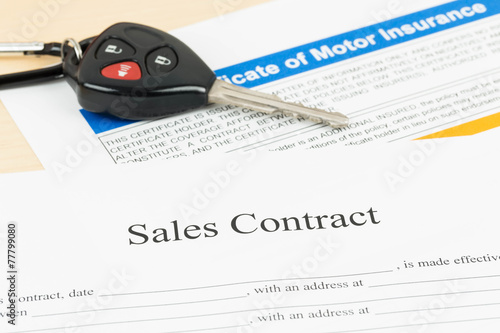 Car sales contract document with key © wirojsid