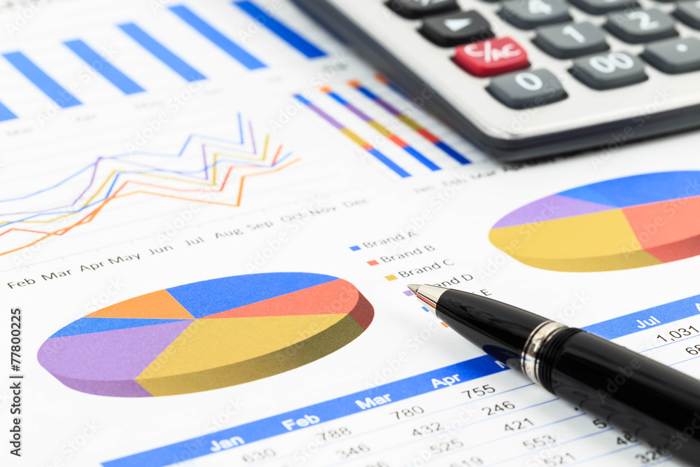 Marketing report chart and graph analysis with pen and calculato Marketing report chart and graph analysis with pen and calculato