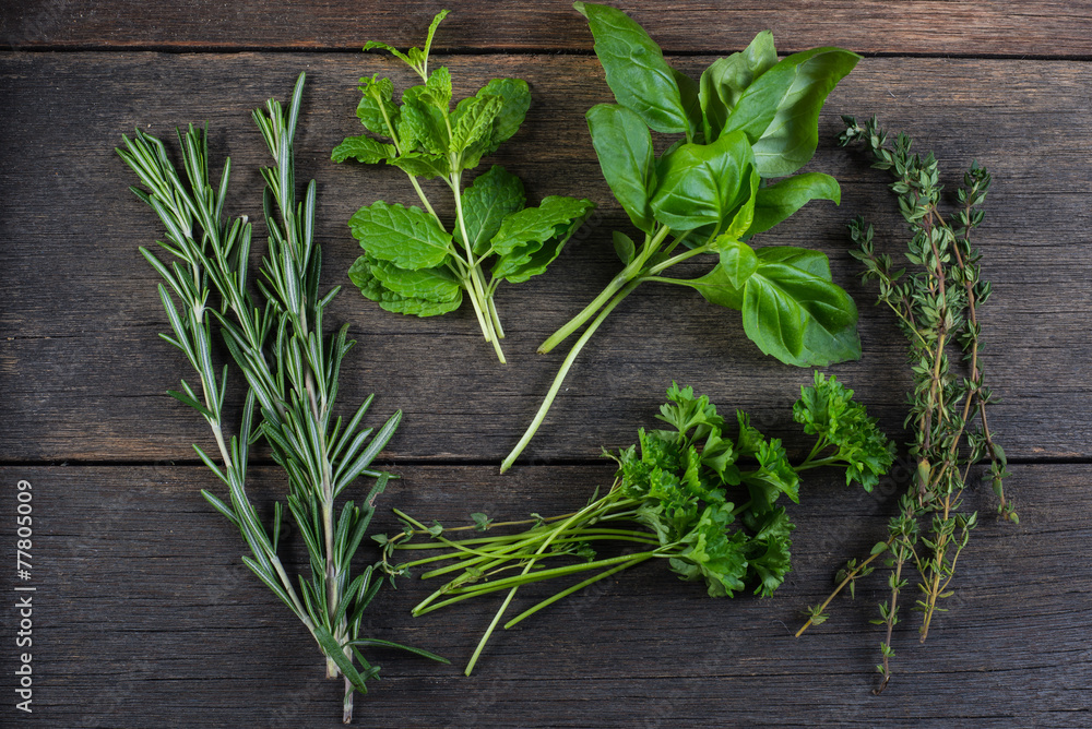 Freshly cliped herbs on wooden background Freshly cliped herbs on wooden background