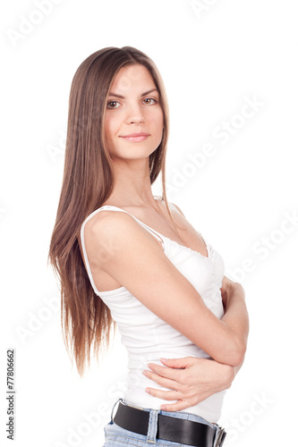 Beautiful brunette woman standing sideways and looking