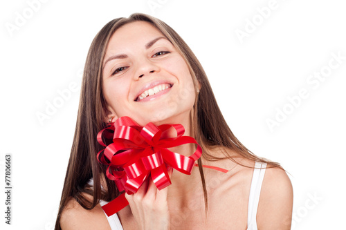 Young woman holding a red bow
