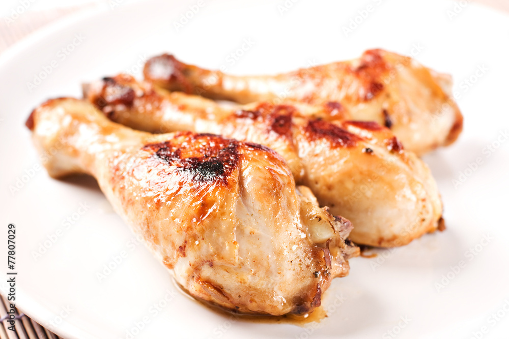 Roasted chicken on a plate Roasted chicken on a plate