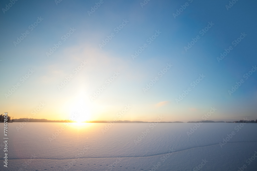 Frozen lake and sunset