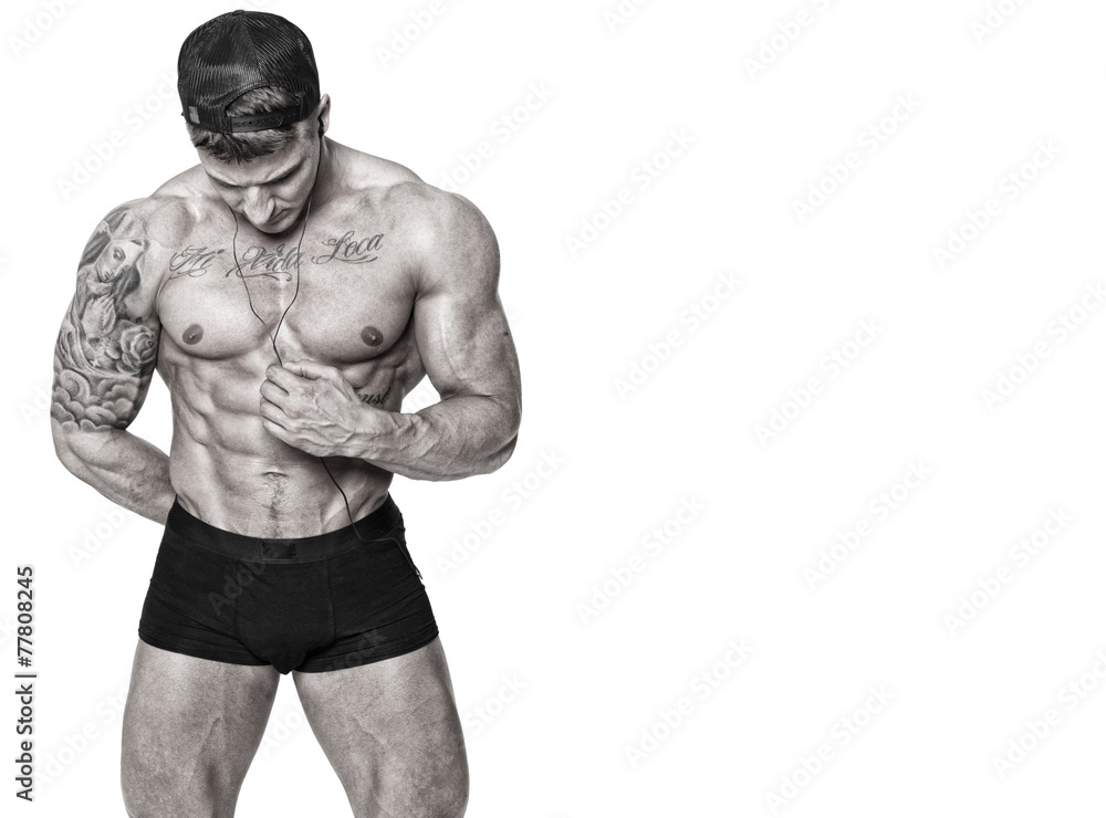 Fototapeta premium Handsome man with naked torso posing in studio