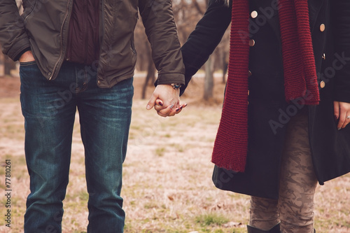 Couple in the park holding hands