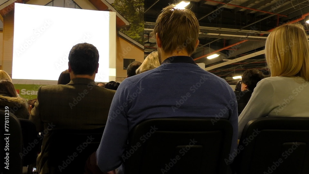 Business seminar audience and blank screen Business seminar audience and blank screen
