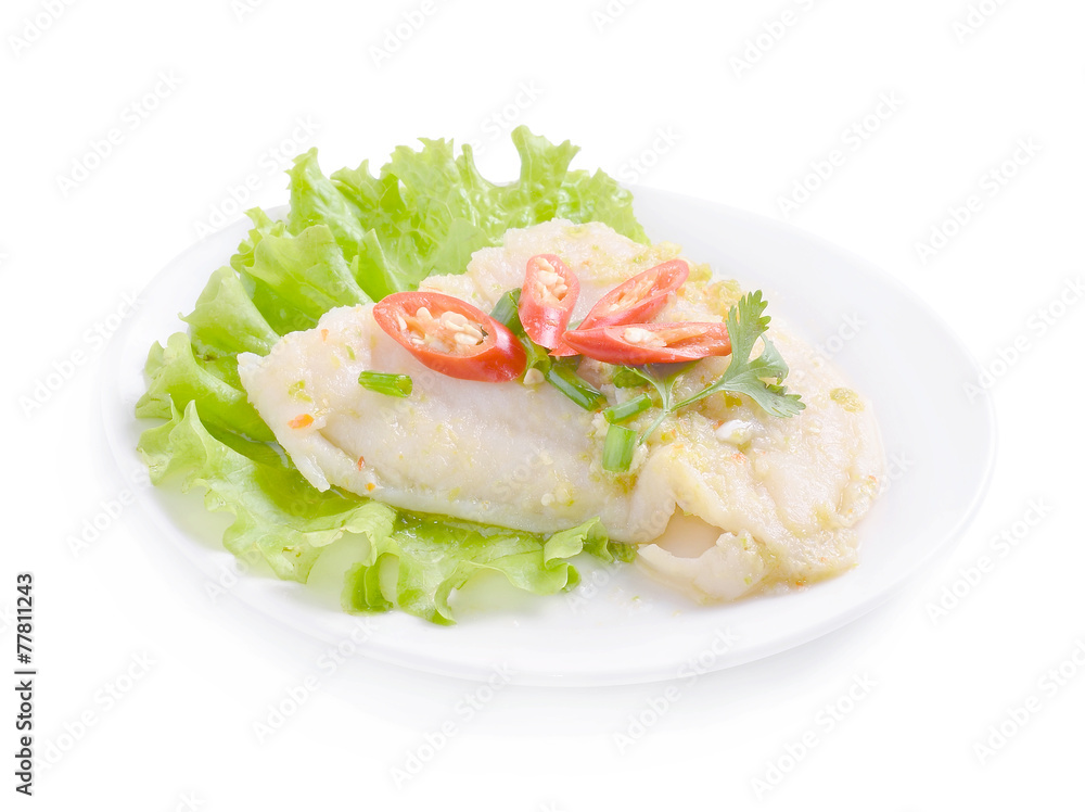 Steamed fish in lime dressing on white background