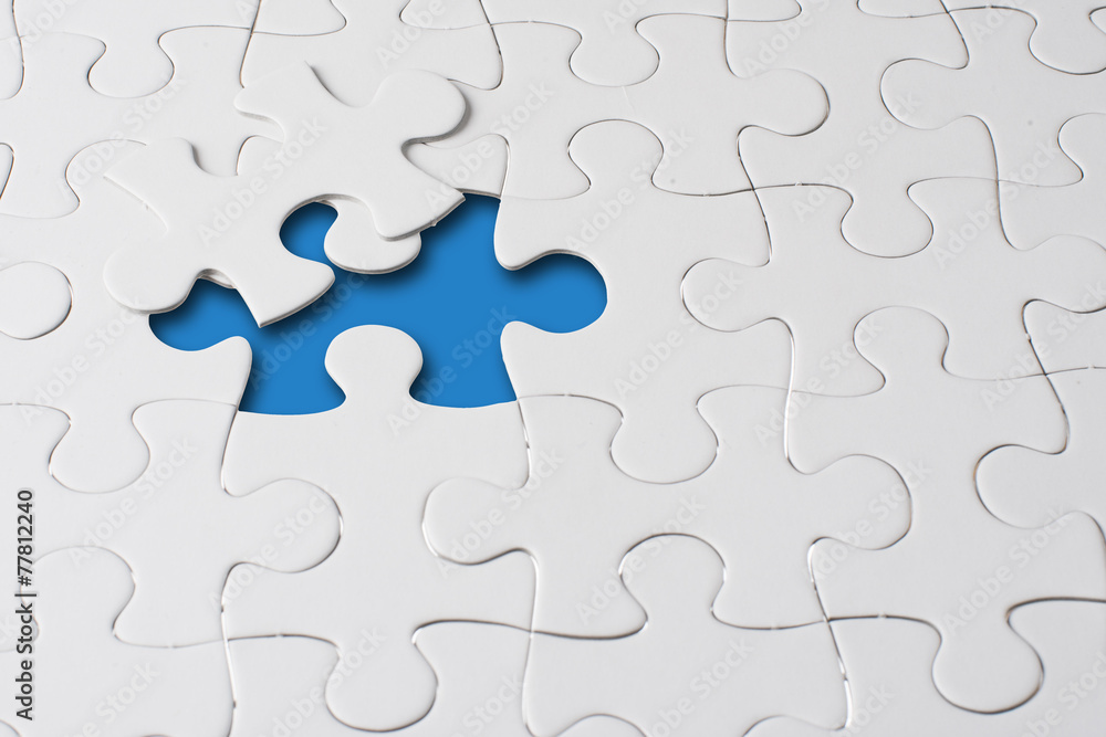 Missing jigsaw puzzle piece with light glow, business concept Missing jigsaw puzzle piece with light glow, business concept