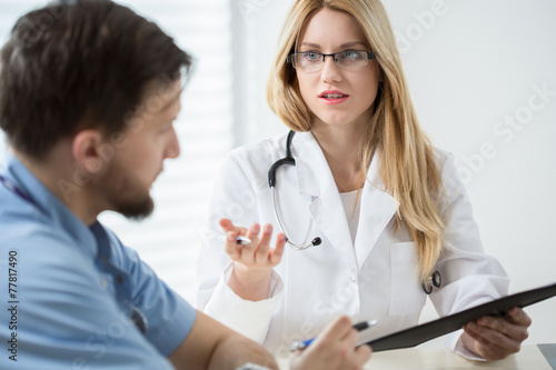 Intern consulting with other doctor