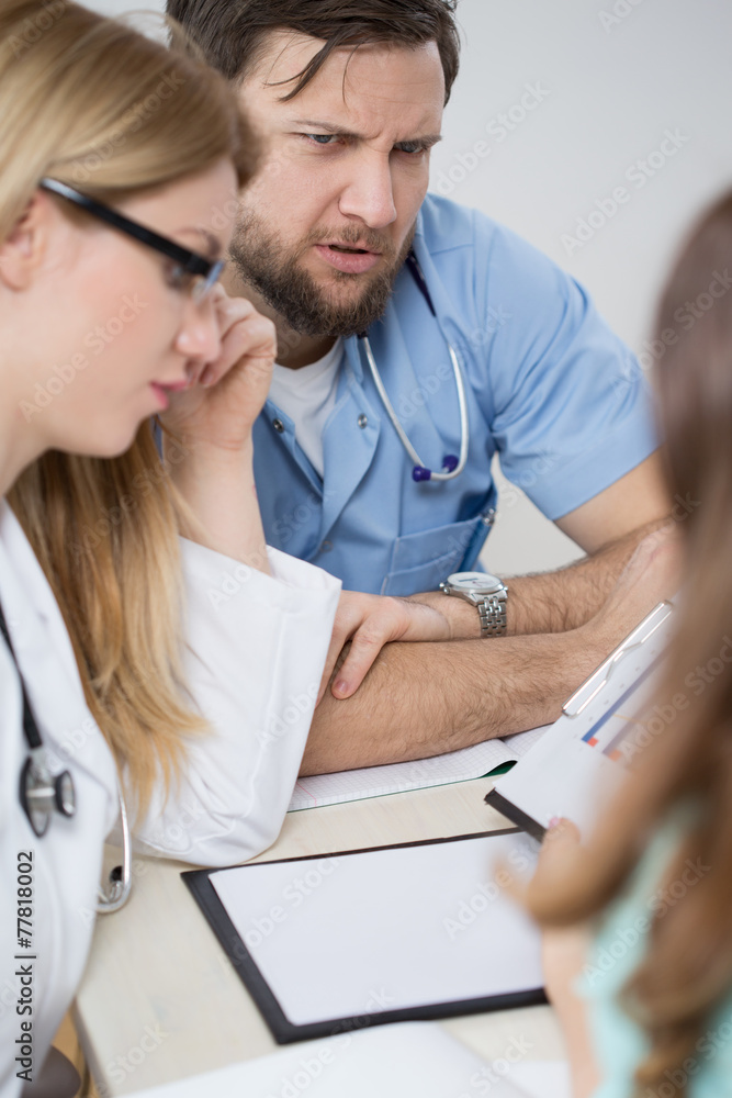 Doctors consulting during medical meeting Doctors consulting during medical meeting