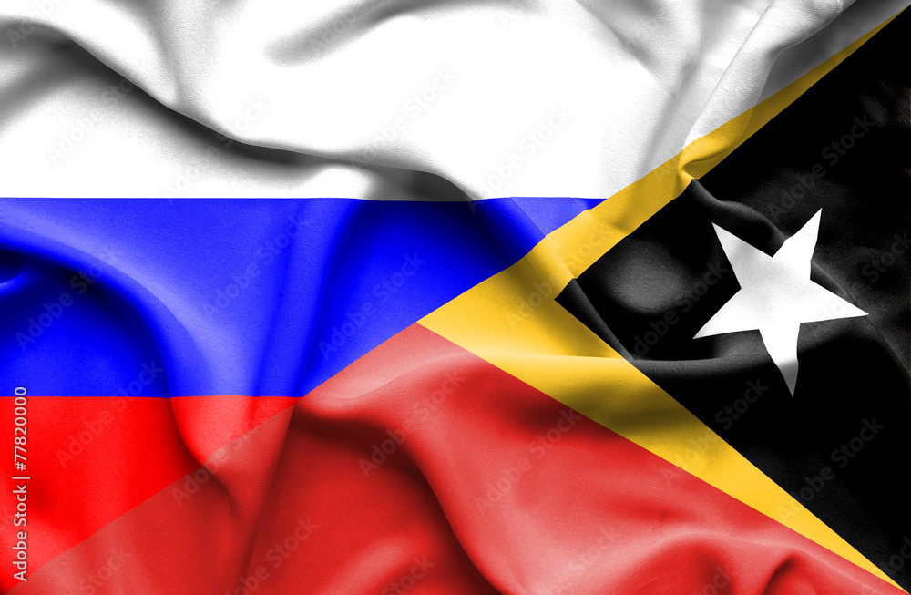 Fototapeta premium Waving flag of East Timor and Russia