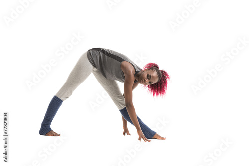 Young african woman doing yoga exercises