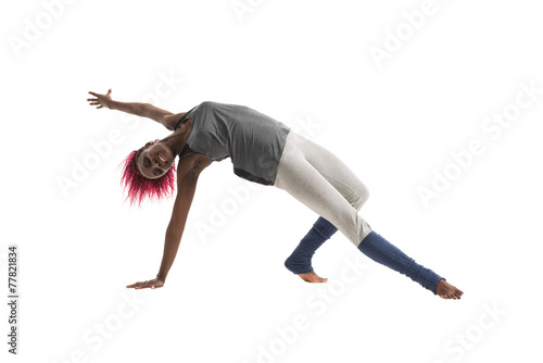 Young african woman doing yoga exercises