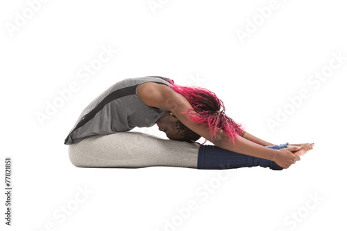 Young african woman doing a stretching exercise