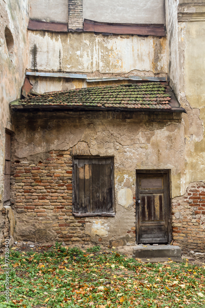 Wall and window of the old abandoned house in Vilnius, Lithuania